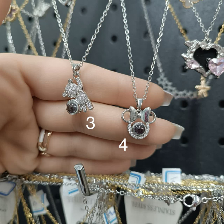 گردنبندهای تلسکوپی صدزبان(داخل نگین دوست دارم به صد زبان نوشته شده)